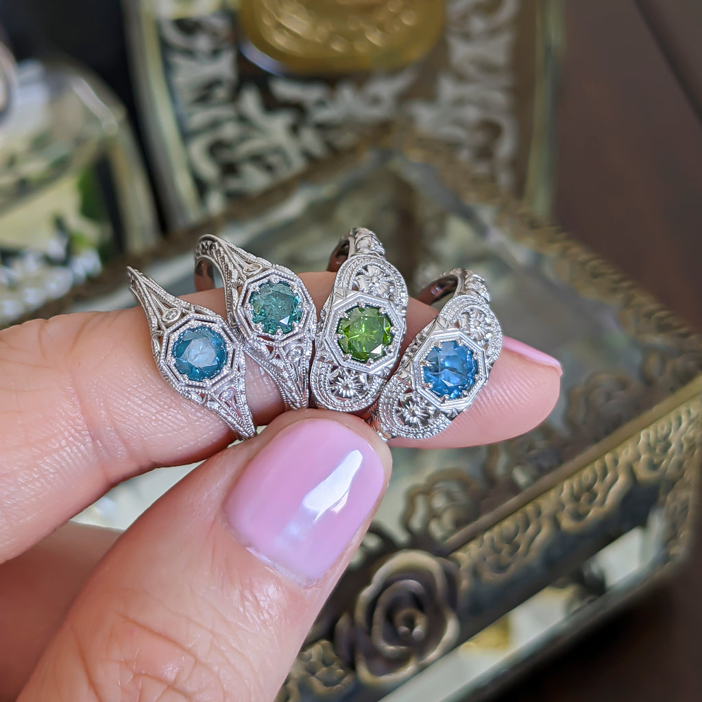 Vintage style rings set with blue and green irradiated diamonds