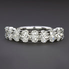2.06ct GIA certified diamond wedding ring in platinum with nine oval cut diamonds. Elegant and modern design.
