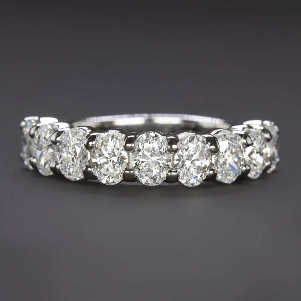 2.06ct GIA certified diamond wedding ring in platinum with nine oval cut diamonds. Elegant and modern design.