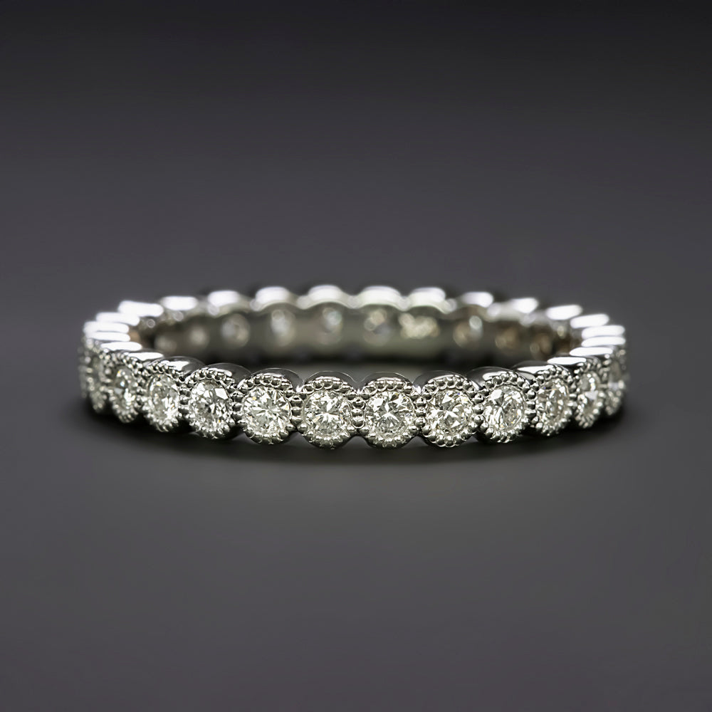 0.56ct natural diamond wedding ring in 14k white gold band with milgrain bezels and full eternity design.