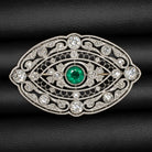 Vintage Art Deco emerald diamond pin pendant in platinum with intricate filigree design.
