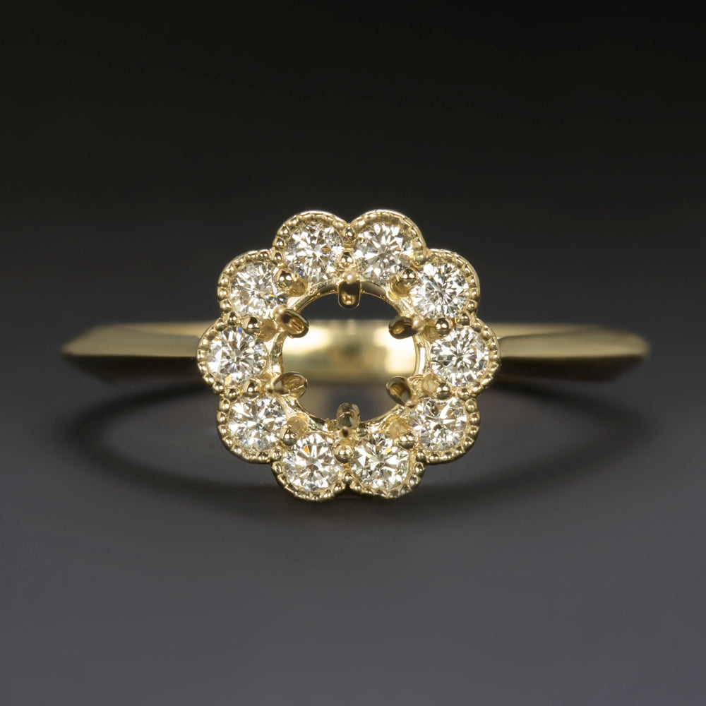Natural diamond ring setting in 14k yellow gold with scalloped halo and space for 5mm round center stone.