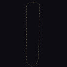 Vintage diamond station necklace in 14k yellow gold, 38 inches long, featuring round and marquise diamonds on a dainty chain.