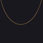 14k yellow gold rollo chain necklace, 20-inch dainty design for men and women, featuring small thick links and lobster clasp.