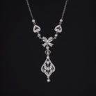 VINTAGE DIAMOND PENDANT BOW RIBBON NECKLACE 18K WHITE GOLD FILIGREE HEART DROP